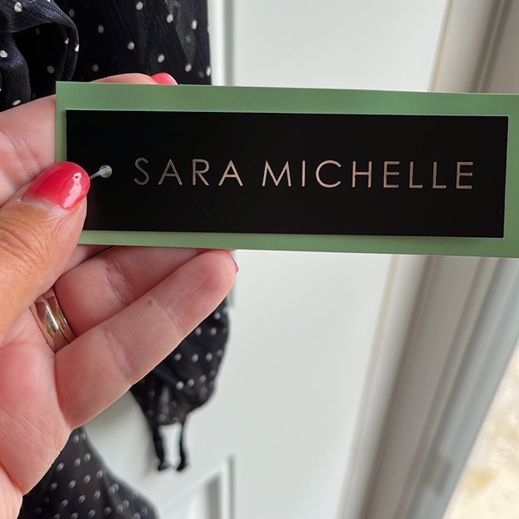 Brand NWT. Navy/ White dot tie sleeve bubble hem blouse. Brand: Sara Michelle - Picture 3 of 5